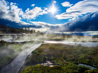 Mountain and river landscape with water mist